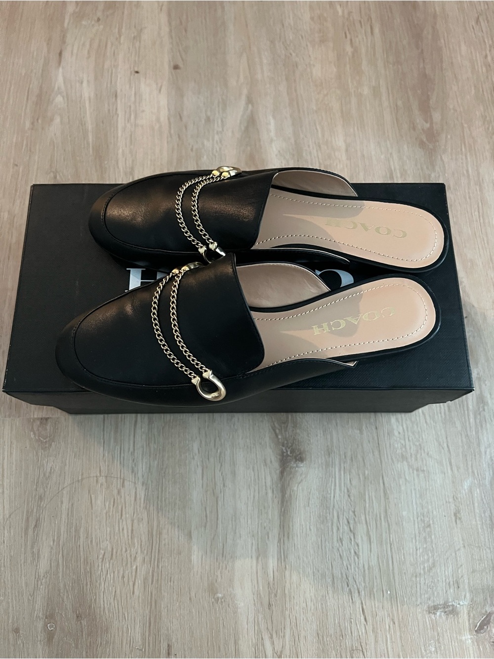 Coach Black Leather Slip-On Mules with Gold Chain Accent